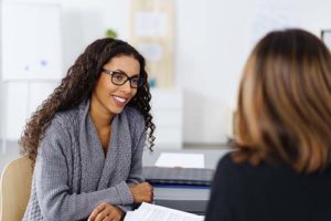 women discussing tax lien discharge